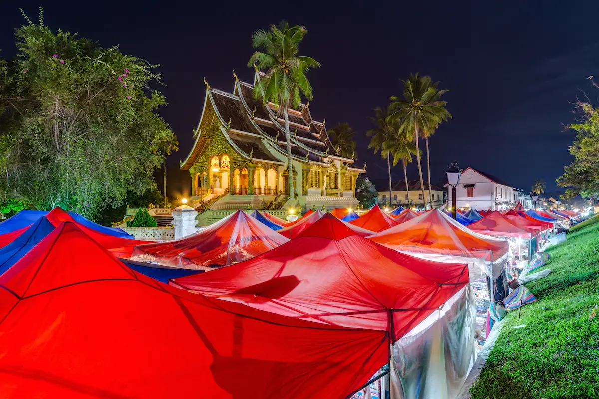 Tents of night market and Royal Palace in Luang Prabang, Laos